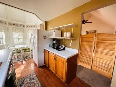 a kitchen with wooden cabinets and a white refrigerator at Whole House at Eaglenest Inn with Pool & Seasonal SPA in Julian