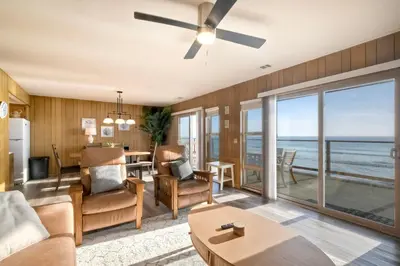 a living room with a view of the ocean at Oceanfront Getaway Ocean Views Fire Pit BBQ Beach Access in Carlsbad