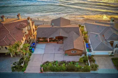 an aerial view of a house next to the ocean at Oceanfront Getaway Ocean Views Fire Pit BBQ Beach Access in Carlsbad