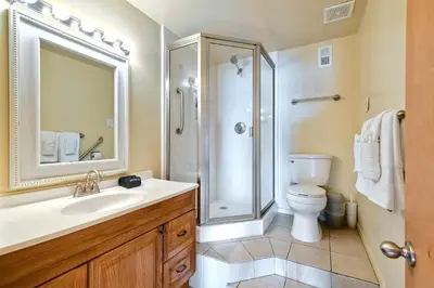 a bathroom with a sink and a shower and a toilet at Oceanfront Getaway Ocean Views Fire Pit BBQ Beach Access in Carlsbad