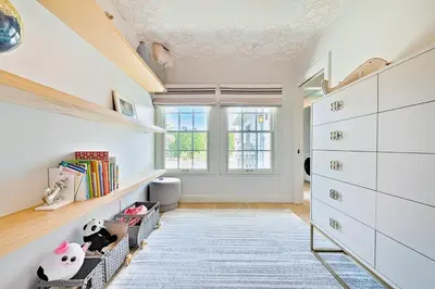 a room with white cabinets and a shelf with books at La Jolla Shores Perfection with Hot Tub, Fence Yard, AC & Grill in San Diego
