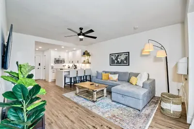 a living room with a couch and a table at 2003 Costa Del Mar Road - Unit 676 in Carlsbad