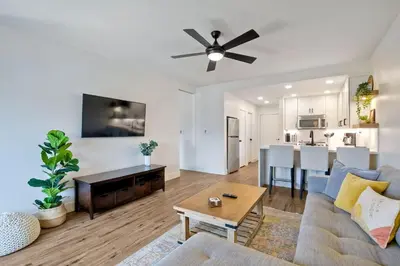 a living room with a couch and a table at 2003 Costa Del Mar Road - Unit 676 in Carlsbad