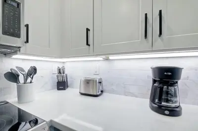 a kitchen counter with a coffee maker on the counter at 2003 Costa Del Mar Road - Unit 676 in Carlsbad