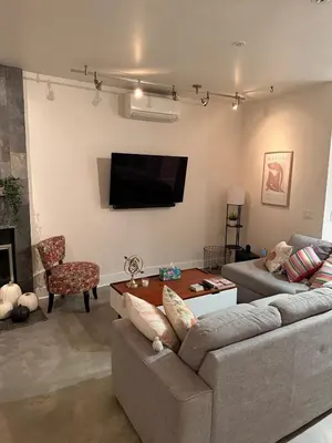 a living room with two couches and a flat screen tv at Close to Ocean and Beach in San Diego