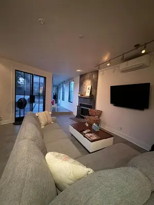 a living room with a couch and a flat screen tv at Close to Ocean and Beach in San Diego