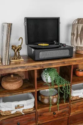 a tv on top of a wooden shelf at Cozy Coastal Stay Hot Tub & Putting Green in San Diego
