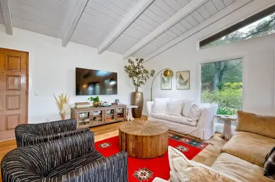 a living room with two chairs and a table at 3046 Skycrest Drive in Fallbrook