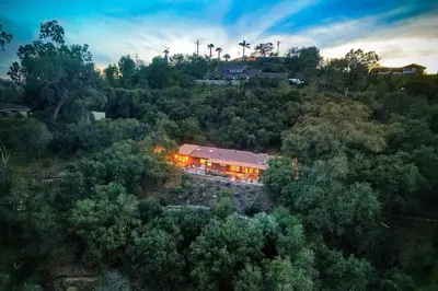 an overhead view of a house with lights in the trees at 3046 Skycrest Drive in Fallbrook