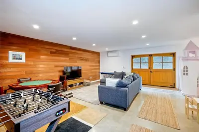 a living room with a ping pong table at 3046 Skycrest Drive in Fallbrook