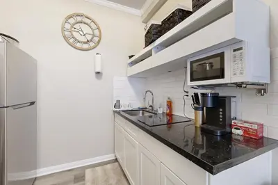 a kitchen with a sink and a microwave at Outdoor Oasis with Pool and Hot Tub Perris Getaway in Perris