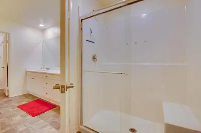 a shower with a glass door in a bathroom at Luxurious and Spacious Family Duplex in Menifee! in Menifee