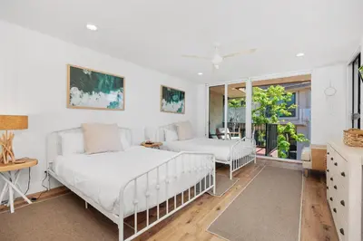 a bedroom with two beds and a window at Dolphin's Drift - DMST50 in Solana Beach