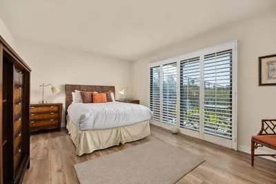a bedroom with a bed and a large window at Sunglow Horizon - DMBC873B in Solana Beach