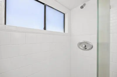 a shower with a glass door and a window at Sunglow Horizon - DMBC873B in Solana Beach