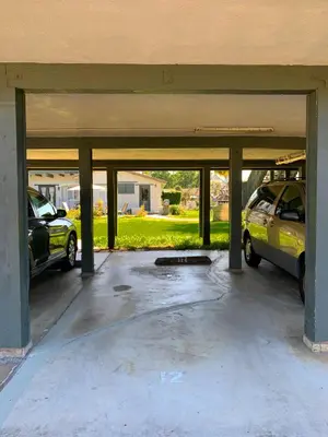 a garage with two cars parked in it at 3080 Lincoln - Unit 12 in Carlsbad