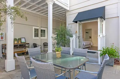 a patio with a glass table and chairs at 3690 Carlsbad Boulevard - Unit C in Carlsbad