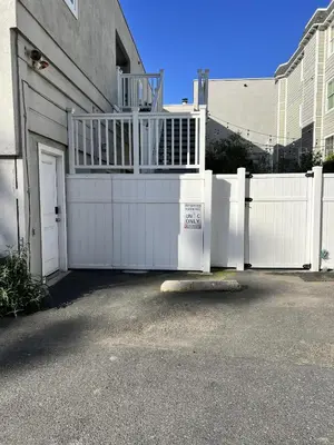a white fence in front of a house at 3690 Carlsbad Boulevard - Unit C in Carlsbad