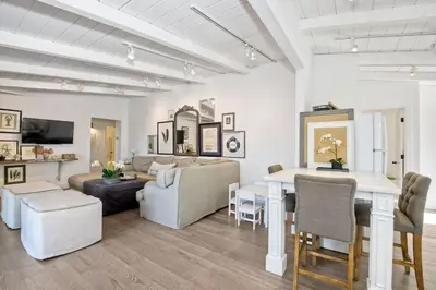 a living room with a couch and a table at 3690 Carlsbad Boulevard - Unit A in Carlsbad