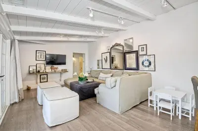 a living room with a couch and a table at 3690 Carlsbad Boulevard - Unit A in Carlsbad