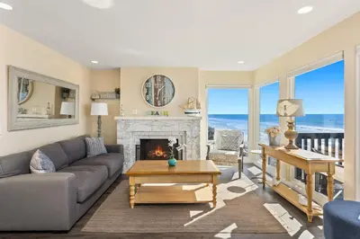 a living room with a couch and a fireplace at 1317 S Pacific - Entire Home in Oceanside