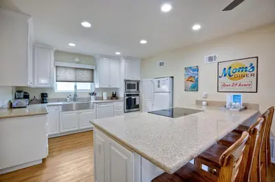 a kitchen with white cabinets and a counter top at 1745 S Pacific in Oceanside