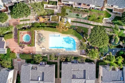 an aerial view of a yard with a swimming pool at 597 S Sierra Avenue - Unit 68 in Solana Beach