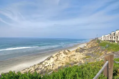 a view of a beach with buildings and the ocean at 597 S Sierra Avenue - Unit 68 in Solana Beach