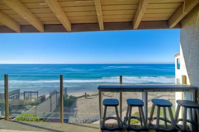 a view of the beach from a balcony with stools at 441 S Sierra - Unit 301 in Solana Beach