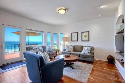 a living room with a couch and chairs and a table at 2751 Ocean Street in Carlsbad