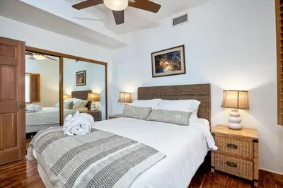 a bedroom with a large bed and a mirror at 2751 Ocean Street in Carlsbad