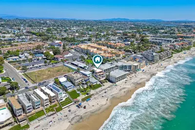 an aerial view of a beach with people and the ocean at 2751 Ocean Street in Carlsbad