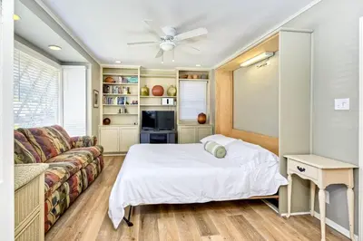a bedroom with a bed and a couch at 1923 S Pacific in Oceanside