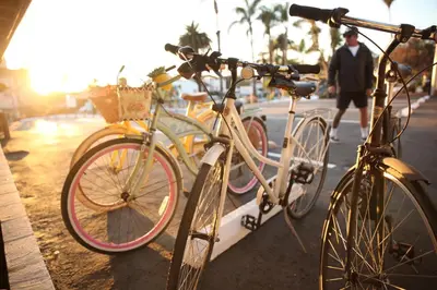 two bikes parked next to each other on a street at West Coast Surf and Stay in San Clemente