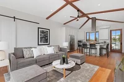 a living room with a couch and a table at 5194 Carlsbad - Upper in Carlsbad