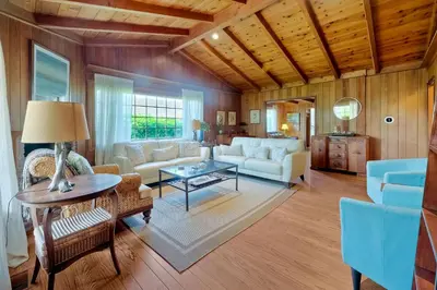 a living room filled with furniture and a wooden ceiling at 5051 Shore Drive in Carlsbad