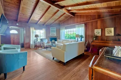 a living room filled with furniture and a piano at 5051 Shore Drive in Carlsbad