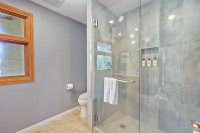 a bathroom with a shower and a toilet at 5051 Shore Drive in Carlsbad