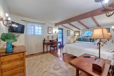 a bedroom with a large bed and a desk at 5051 Shore Drive in Carlsbad