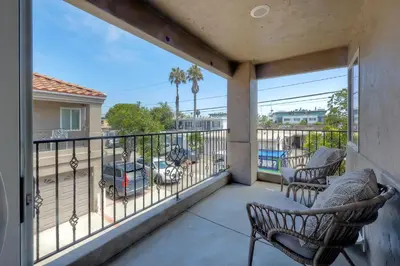 a balcony with chairs and a view of a parking lot at 1128 Tait Street Unit D in Oceanside