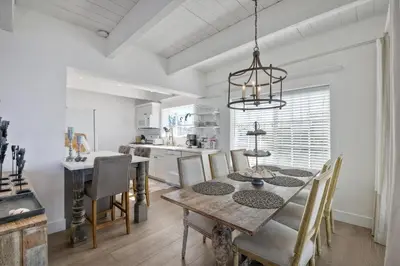 a kitchen and dining room with a table and chairs at 3690 Carlsbad Boulevard - Entire Home in Carlsbad