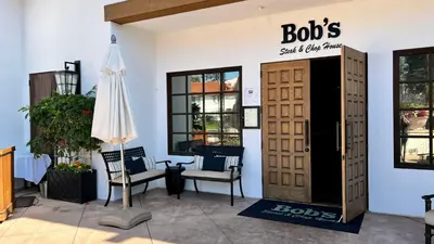 a room with a pair of chairs and a door at 2003 Costa Del Mar Road - Unit 663 in Carlsbad