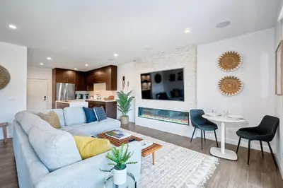 a living room with a couch and a fireplace at 2003 Costa Del Mar Road - Unit 660 in Carlsbad
