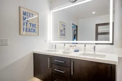 a bathroom with a sink and a mirror at 2003 Costa Del Mar Road - Unit 660 in Carlsbad