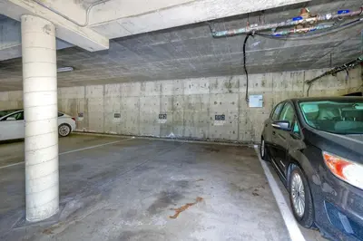 a parking garage with a car parked in it at 2003 Costa Del Mar Road - Unit 660 in Carlsbad