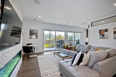 a living room with a couch and a large aquarium at 2003 Costa Del Mar Road - Unit 660 in Carlsbad