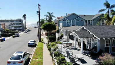 a row of houses on a street with cars parked at 180 Walnut Lower in Carlsbad