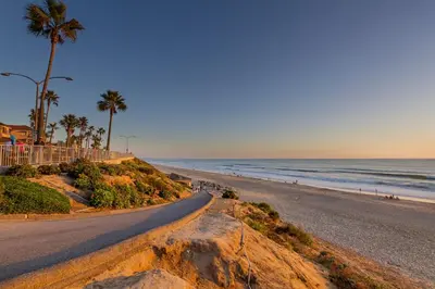 a road leading down to a beach with palm trees at 180 Walnut Lower in Carlsbad