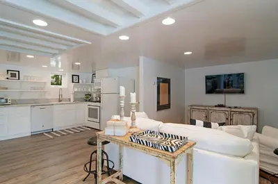 a living room with a white couch and a table at 180 Walnut Lower in Carlsbad