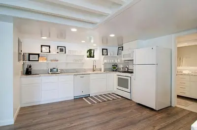 a kitchen with white cabinets and a white refrigerator at 180 Walnut Lower in Carlsbad